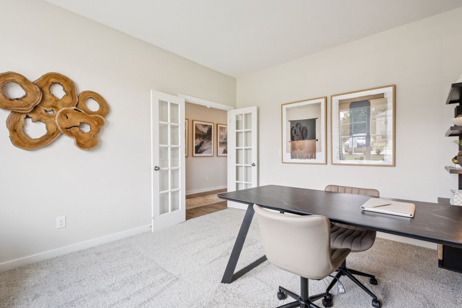 A room with a desk and chairs. A room with a desk and chairs.