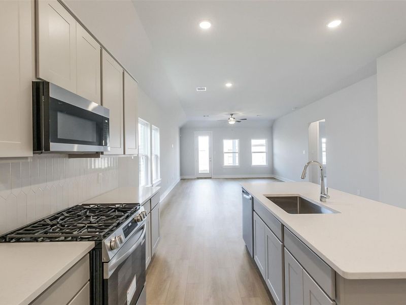 Furnished interior view inside a new home in Sunterra, Katy (Image 12).