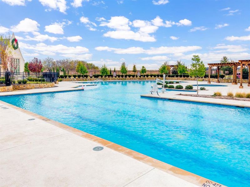 Community pool with a pergola and a patio area
