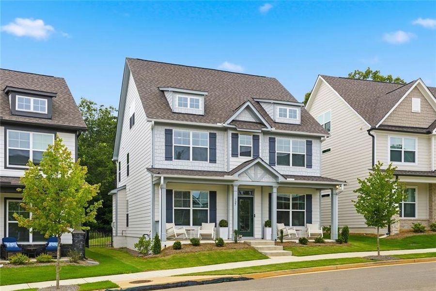 Front exterior of a new home in Marble Tree, Ball Ground, GA, highlighting curb appeal (Image 2). Front exterior of a new home in Marble Tree, Ball Ground, GA, highlighting curb appeal (Image 2).