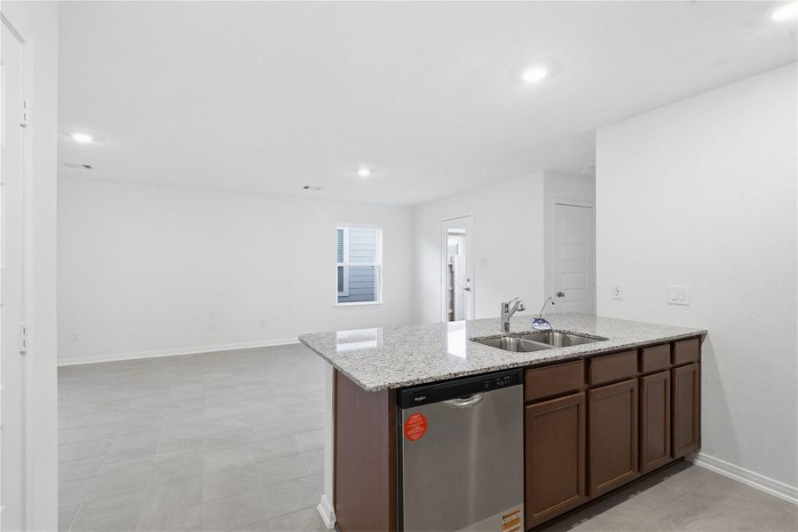 Beautiful open-concept layout effortlessly uniting the family, dining, and kitchen spaces—ideal for everyday comfort and entertaining guests!