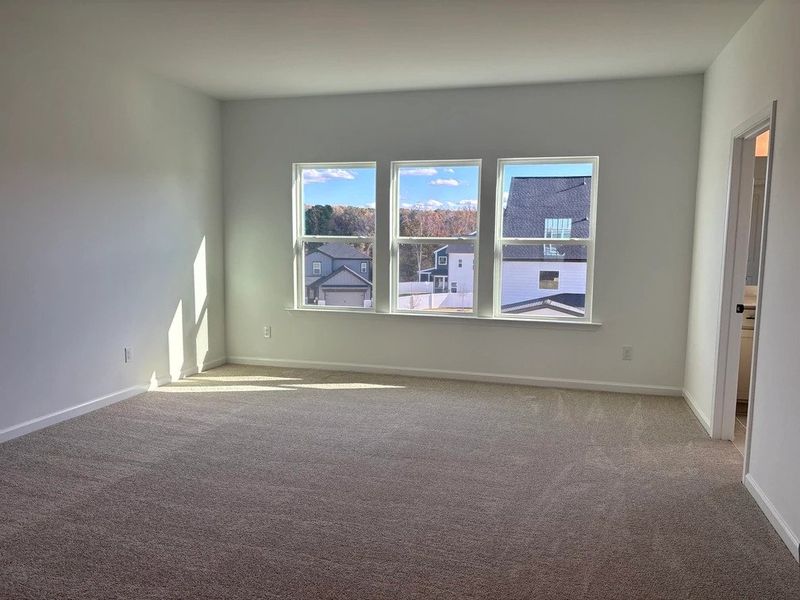 Primary Bed featuring the AW Collection® Foundry - A streamlined space for total rest.