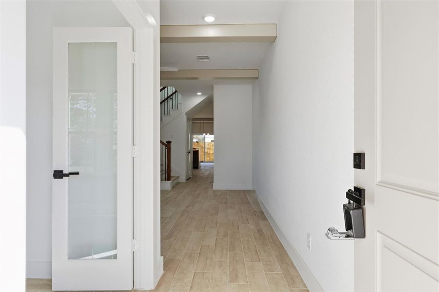 pon entering the home, the office is to the left, and the living room lies straight ahead.