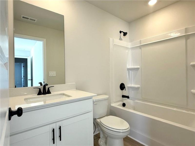 Furnished interior view inside a new home in Vines at Mill Creek - Estate Series, Braselton (Image 9).