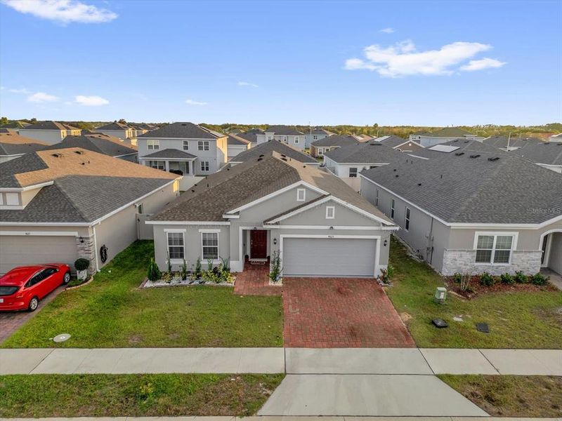 Front exterior of a new home in Hammock Reserve, Haines City, FL, highlighting curb appeal (Image 2).