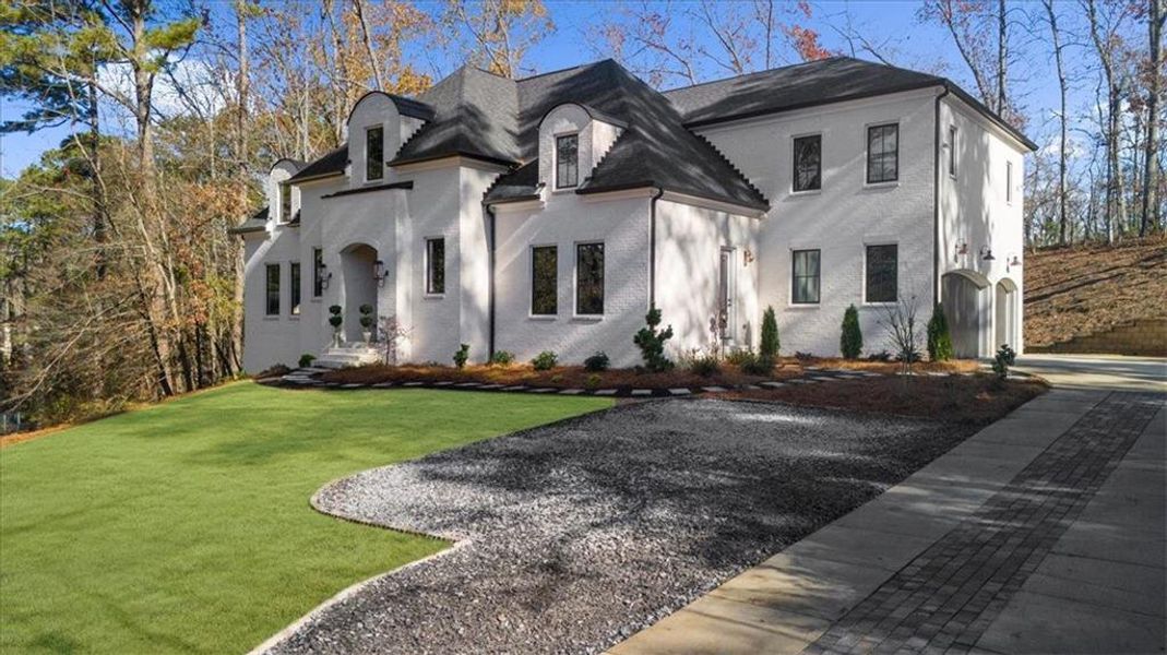 Front exterior of a new home in , Roswell, GA, highlighting curb appeal (Image 26). Front exterior of a new home in , Roswell, GA, highlighting curb appeal (Image 26).