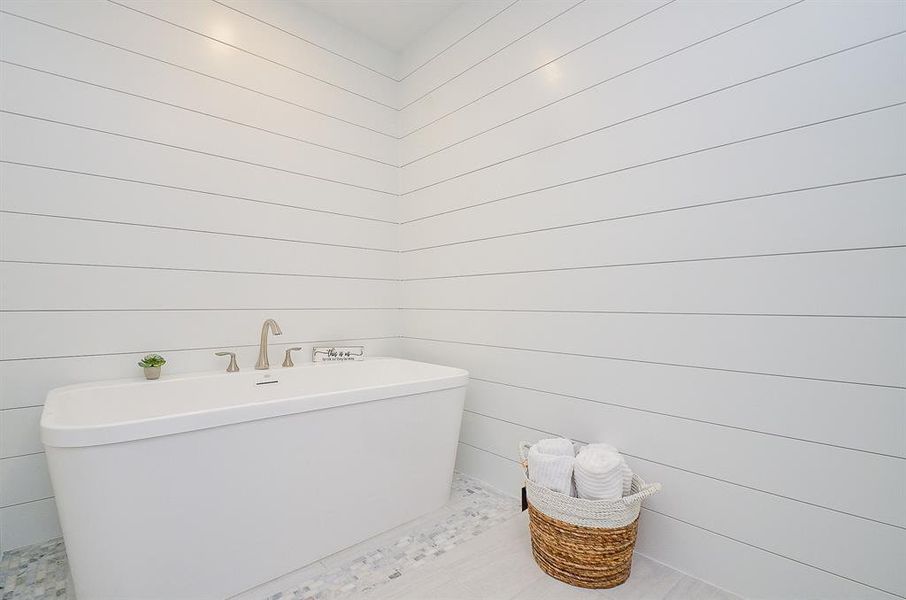 Primary bathroom with shower and soaking tub:Photo is not of the actual home, but is an inspirational photo of the the builder's model and may depict options, furnishings, and/or decor features that are not included.Photos of home will be uploaded shortly.