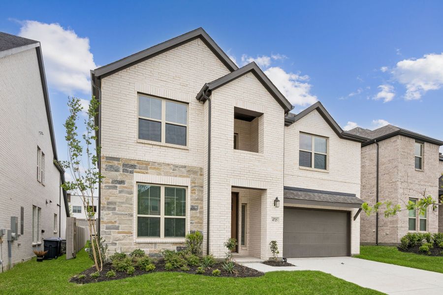 Front exterior of a new home in Painted Tree Woodland West, McKinney, TX, highlighting curb appeal (Image 2). Front exterior of a new home in Painted Tree Woodland West, McKinney, TX, highlighting curb appeal (Image 2).