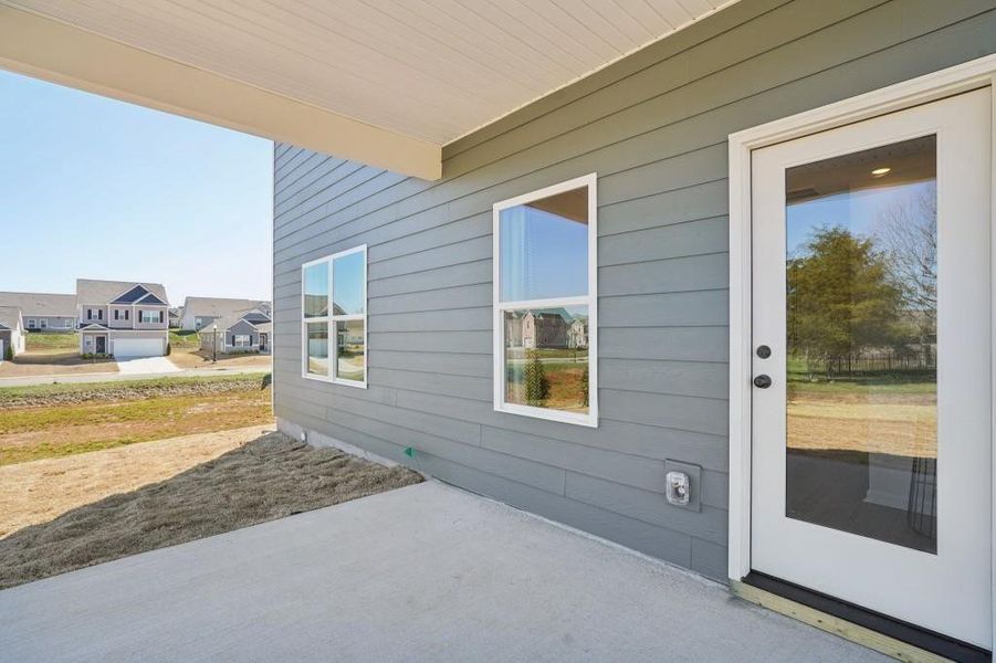 Exterior details and patio area of a home in Sycamore Crest, Calhoun (Image 2).