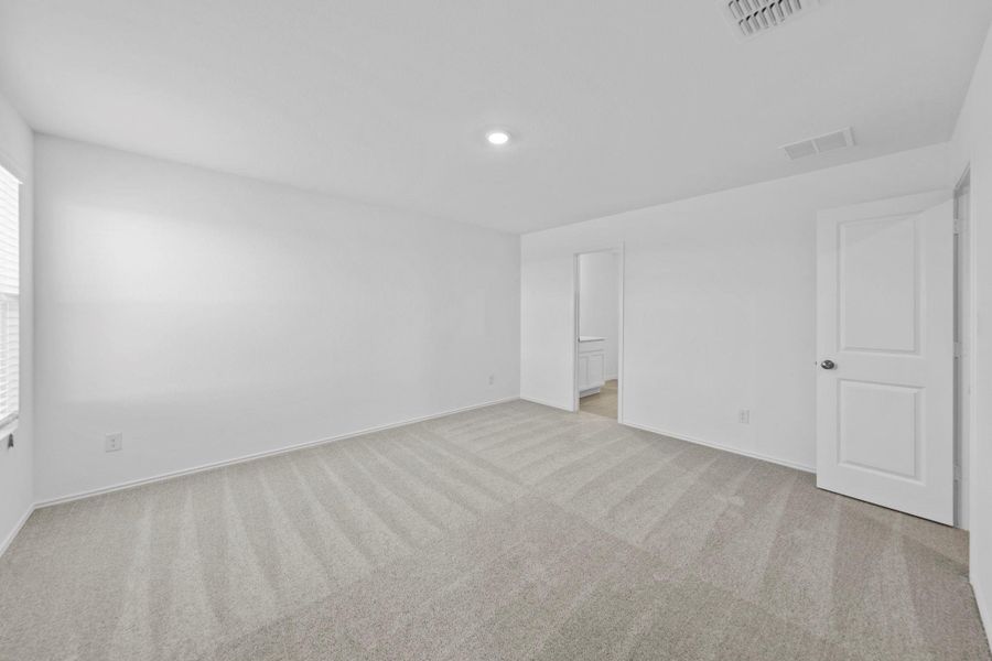 Unfurnished room with light carpet and baseboards