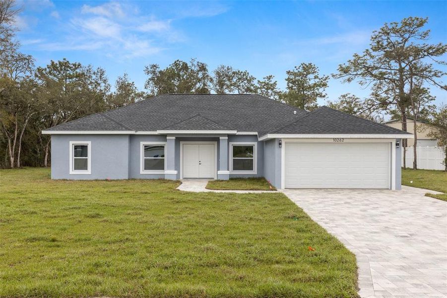 Front exterior of a new home in , Weeki Wachee, FL, highlighting curb appeal (Image 2).
