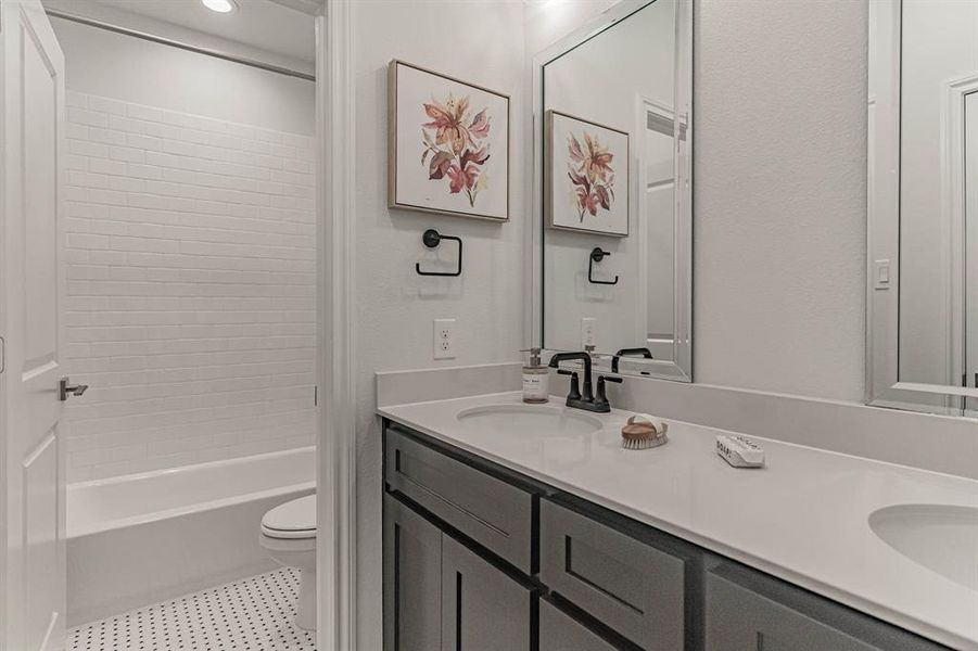 Double vanities and separate room for potty and tub shower. Double vanities and separate room for potty and tub shower.