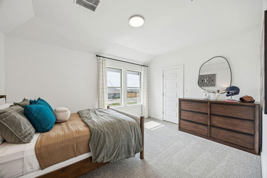 Bedroom in the Trinity home plan by Trophy Signature Homes – REPRESENTATIVE PHOTO