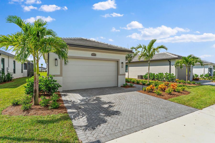 Front exterior of a new home in , Port St. Lucie, FL, highlighting curb appeal (Image 20). Front exterior of a new home in , Port St. Lucie, FL, highlighting curb appeal (Image 20).