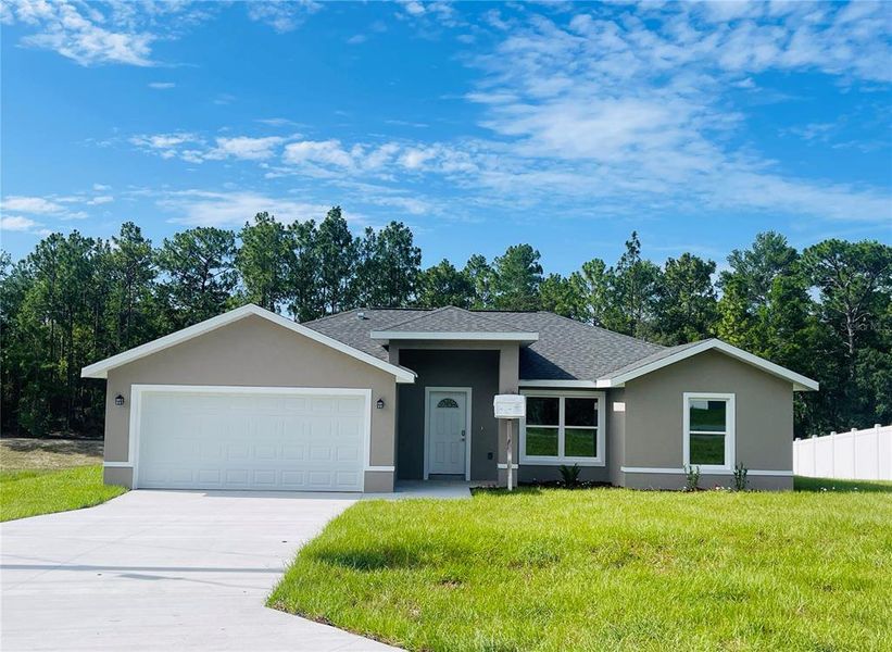 Front exterior of a new home in , Ocala, FL, highlighting curb appeal (Image 2). Front exterior of a new home in , Ocala, FL, highlighting curb appeal (Image 2).