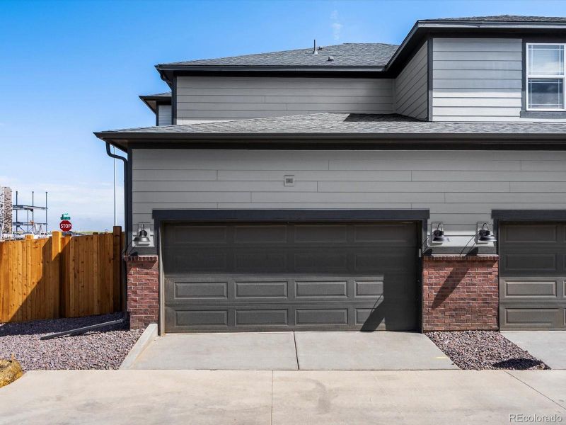 Exterior details and patio area of a home in Horizon Uptown: The Mountain Collection, Aurora (Image 3). Exterior details and patio area of a home in Horizon Uptown: The Mountain Collection, Aurora (Image 3).