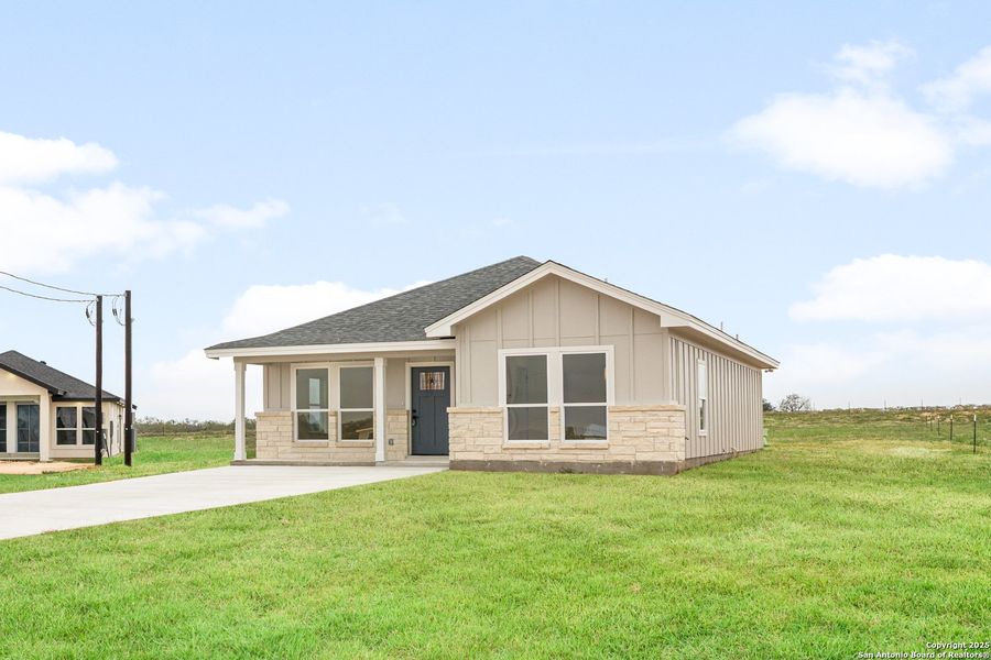 Front exterior of a new home in , La Vernia, TX, highlighting curb appeal (Image 16).