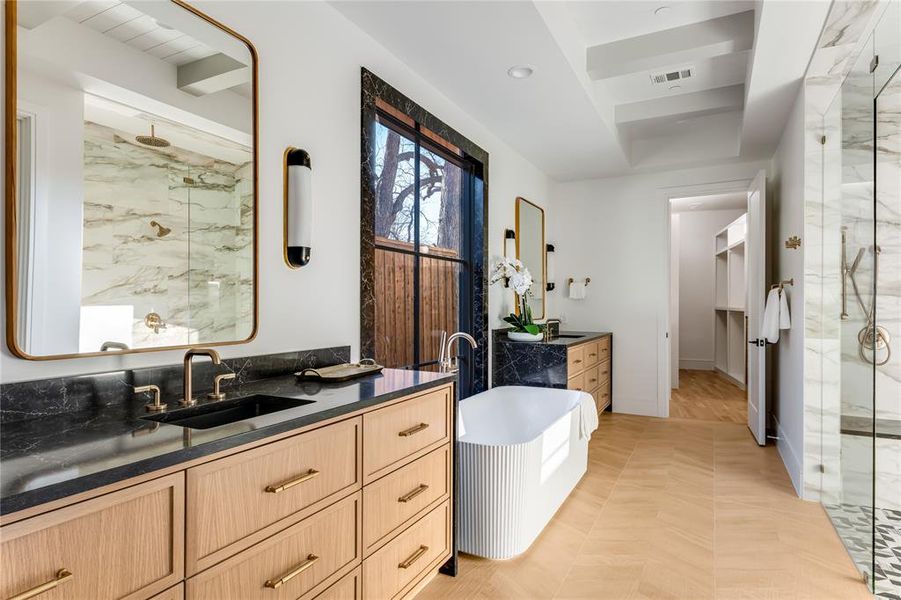 Bathroom featuring vanity and a shower with door