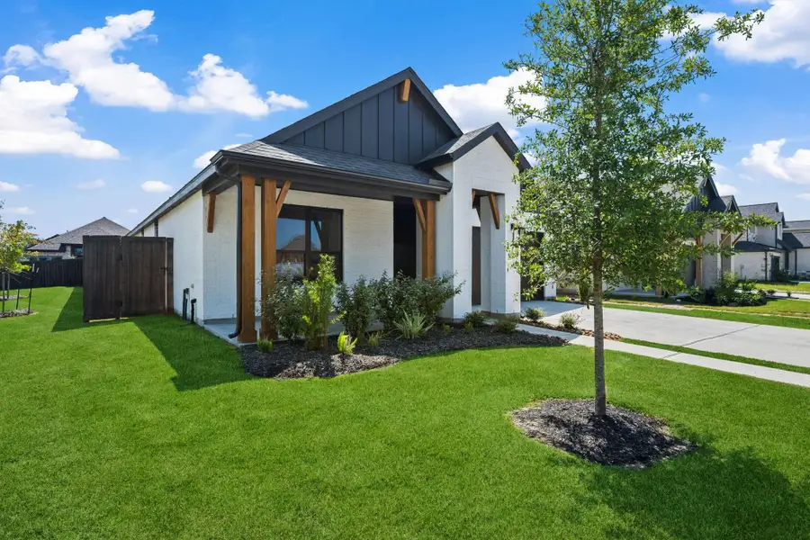 Front exterior of a new home in Riceland: 50ft. lots, Mont Belvieu, TX, highlighting curb appeal (Image 2). Front exterior of a new home in Riceland: 50ft. lots, Mont Belvieu, TX, highlighting curb appeal (Image 2).