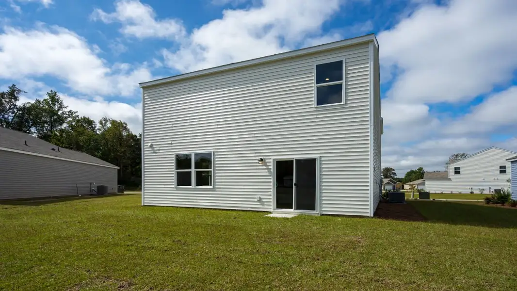 Exterior details and patio area of a home in The Pines at Blake Farm, Wilmington (Image 2).