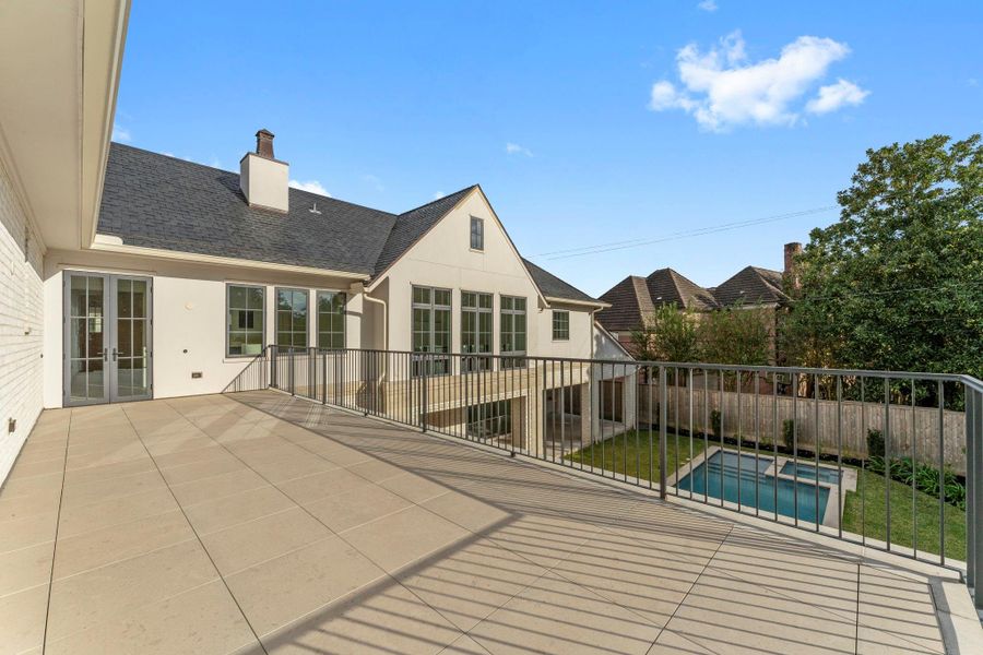 The primary suite features a large private terrace overlooking the sparkling pool and grounds The primary suite features a large private terrace overlooking the sparkling pool and grounds