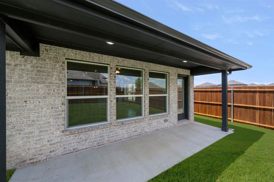 Exterior details and patio area of a home in Summer Crest, Crowley (Image 4).