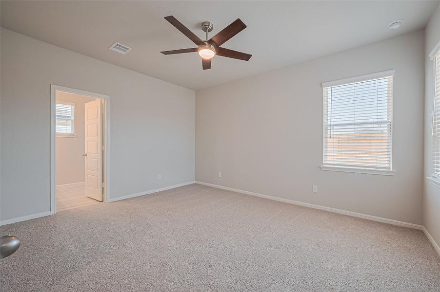 Spacious, unfurnished interior of a new home in Sunterra, Katy (Image 24).
