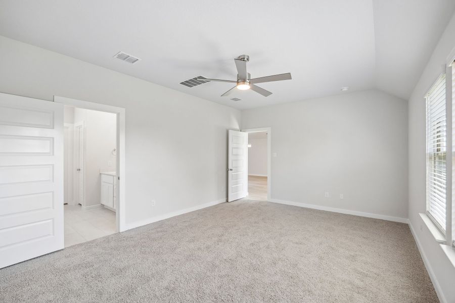 Primary Suite in the Oscar home plan by Trophy Signature Homes – REPRESENTATIVE PHOTO