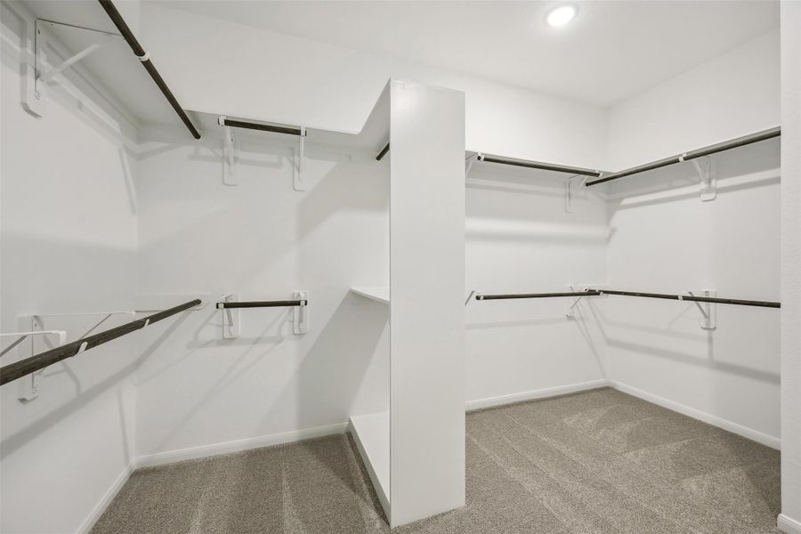 Walk-in closet in the primary suite (*Photo not of actual home and used for illustration purposes only.)