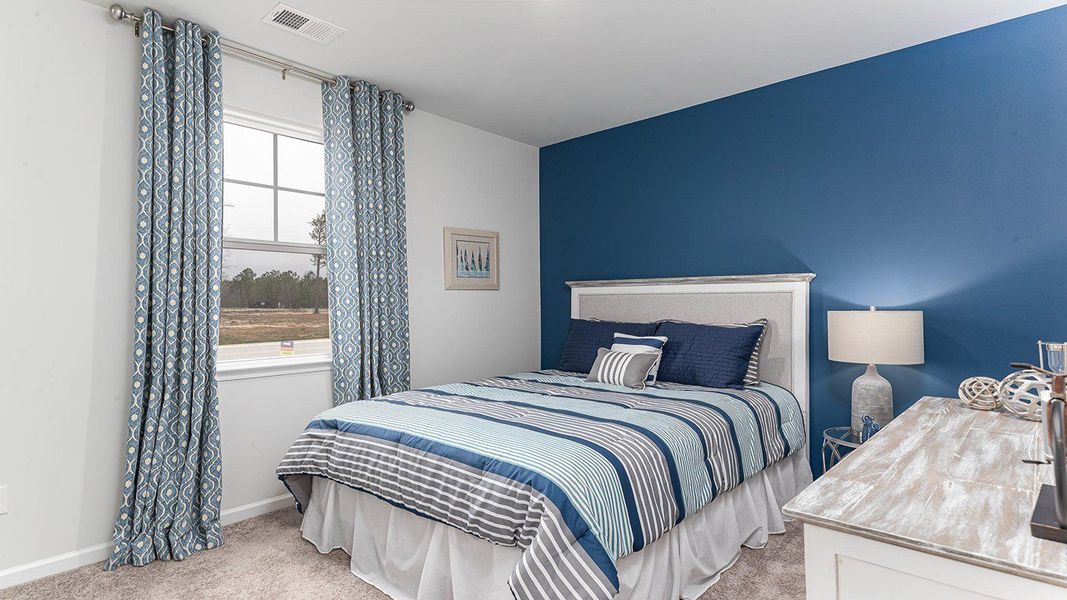 Furnished interior view inside a new home in Stanbury Creek, Supply (Image 13).