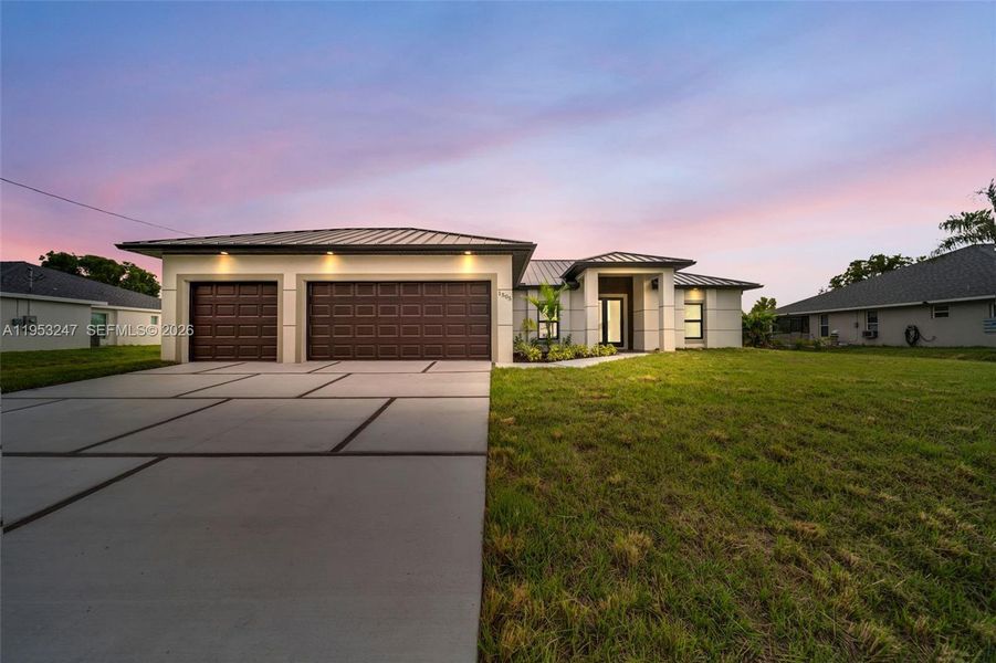 Front exterior of a new home in , Cape Coral, FL, highlighting curb appeal (Image 26).