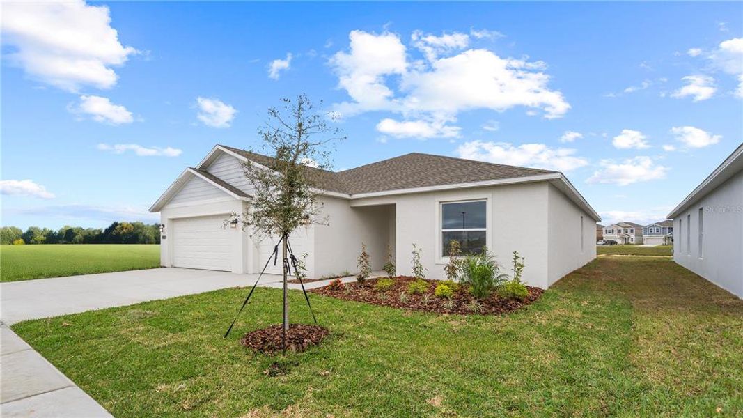 Front exterior of a new home in , Eagle Lake, FL, highlighting curb appeal (Image 19). Front exterior of a new home in , Eagle Lake, FL, highlighting curb appeal (Image 19).