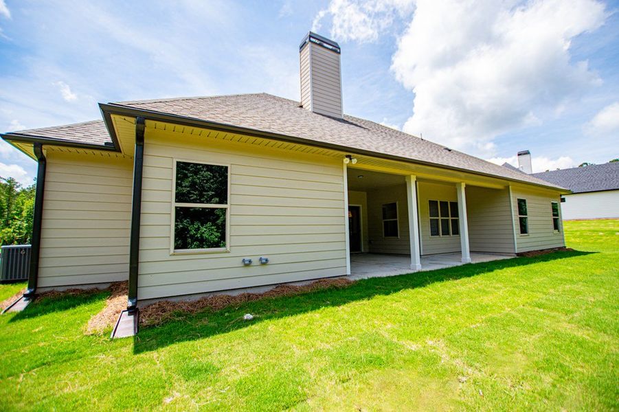 Exterior details and patio area of a home in WOODMONT RESERVE, Roopville (Image 33).