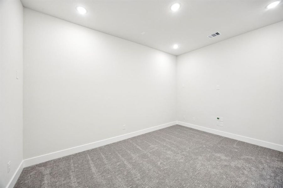 This fantastic media room is the perfect place to host those big game day parties!