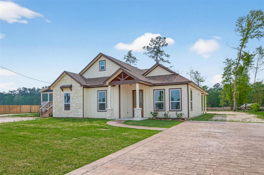 Front exterior of a new home in , Huffman, TX, highlighting curb appeal (Image 25).