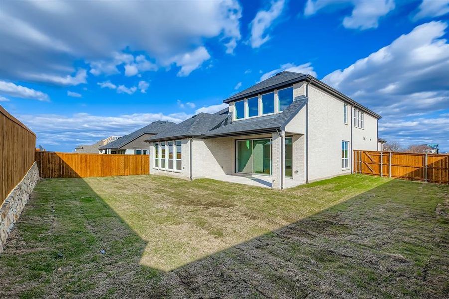 Exterior details and patio area of a home in Wildridge, Oak Point (Image 20).