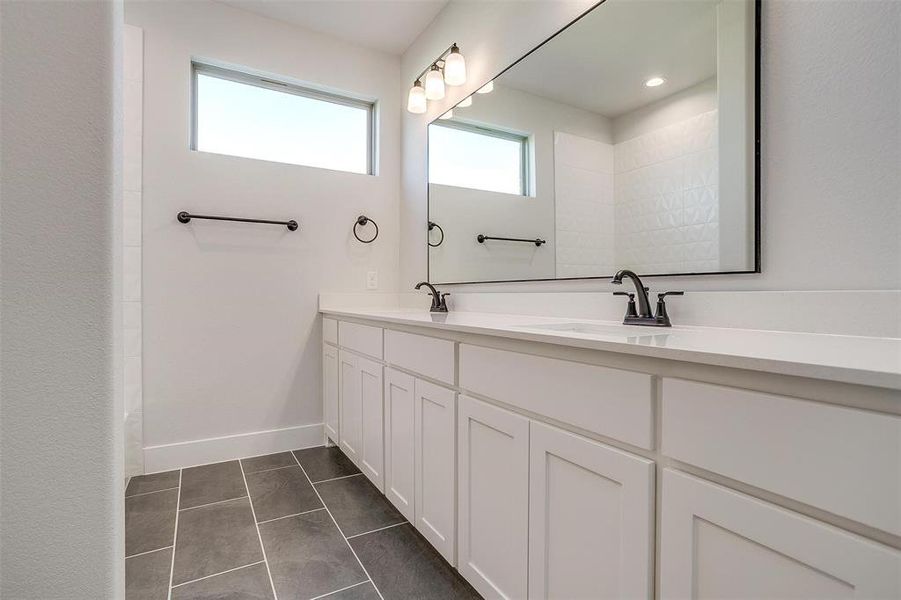 Bathroom with vanity and tile patterned flooring