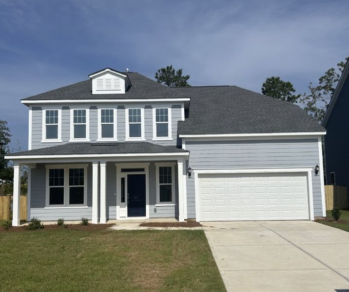 Front exterior of a new home in Pebble Branch, Chapin, SC, highlighting curb appeal (Image 1). Front exterior of a new home in Pebble Branch, Chapin, SC, highlighting curb appeal (Image 1).