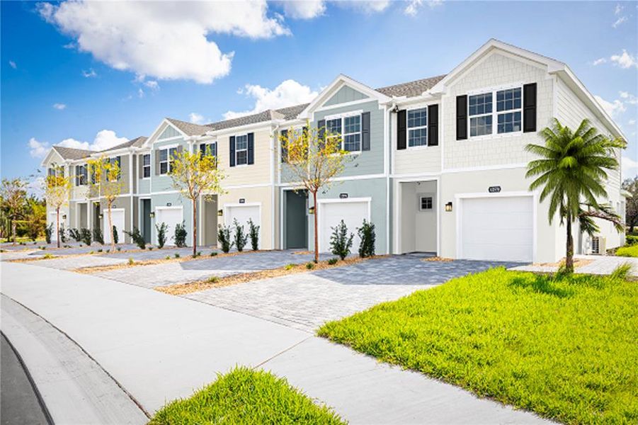 Front exterior of a new home in Kendall Pointe, Melbourne, FL, highlighting curb appeal (Image 1). Front exterior of a new home in Kendall Pointe, Melbourne, FL, highlighting curb appeal (Image 1).