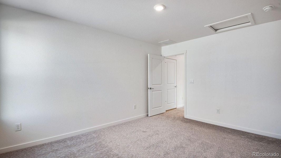 Spacious, unfurnished interior of a new home in Sky Ranch, Watkins (Image 36).