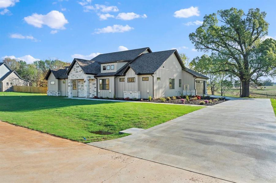 Front exterior of a new home in , Tyler, TX, highlighting curb appeal (Image 27).
