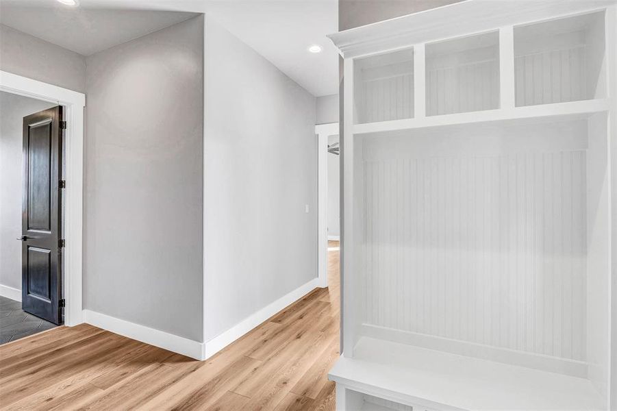 Mudroom with hardwood / wood-style flooring