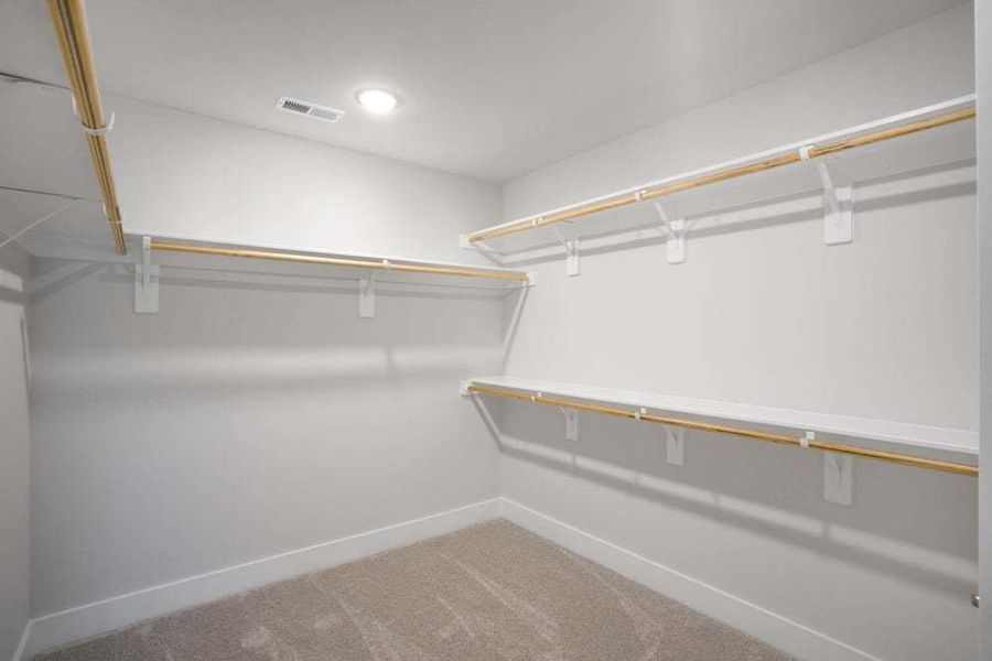 Owners Suite Closet with Wood Shelving