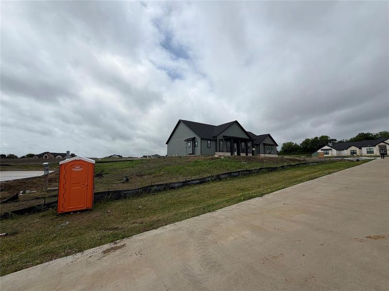 View of front of house with covered porch and a front yard View of front of house with covered porch and a front yard