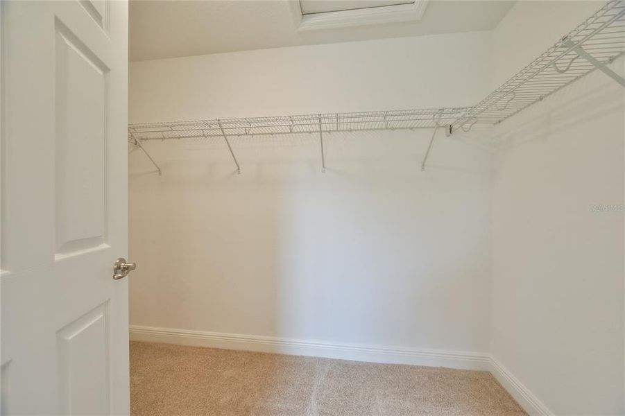 Primary Bedroom Walk in Closet Closet