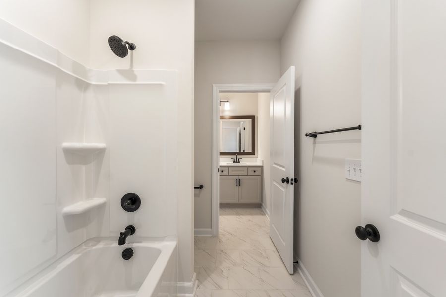 Furnished interior view inside a new home in Landing at Pine Lake, Anderson (Image 15).