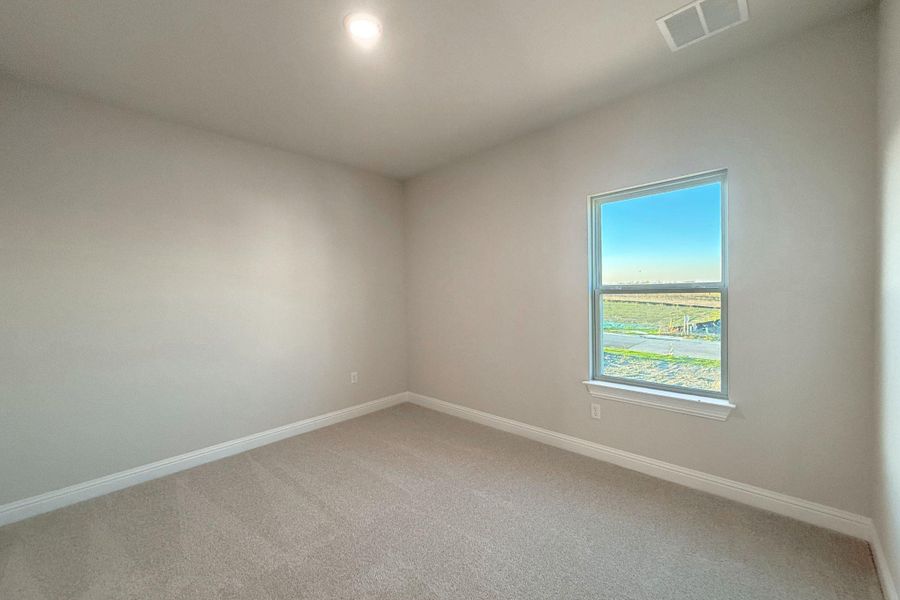 Unfurnished room with baseboards and carpet floors