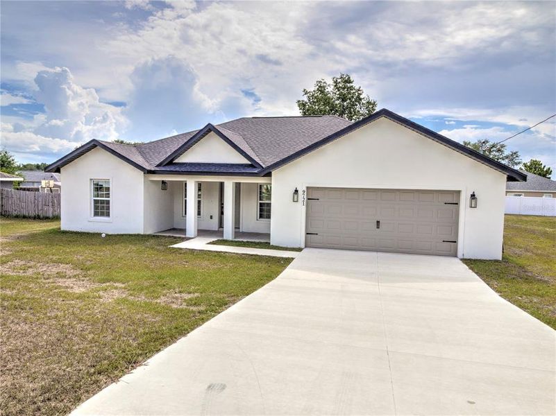 Front exterior of a new home in , Ocala, FL, highlighting curb appeal (Image 1). Front exterior of a new home in , Ocala, FL, highlighting curb appeal (Image 1).