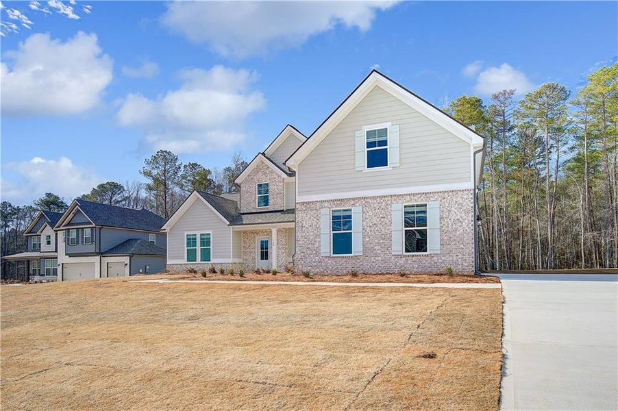 Front exterior of a new home in Riverbend Overlook, Fayetteville, GA, highlighting curb appeal (Image 18).