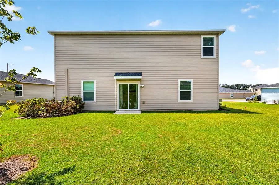 Exterior details and patio area of a home in Tara Forest East, Alachua (Image 3).